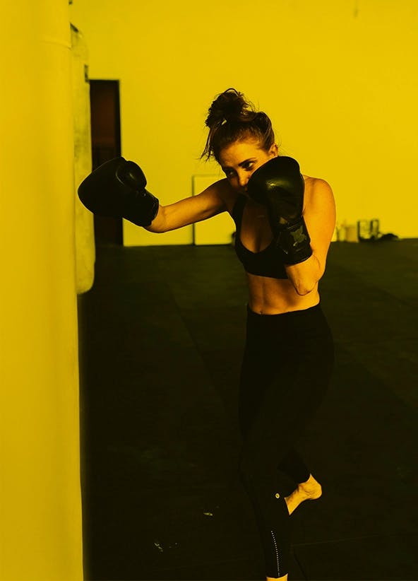 Woman training on a punch bag